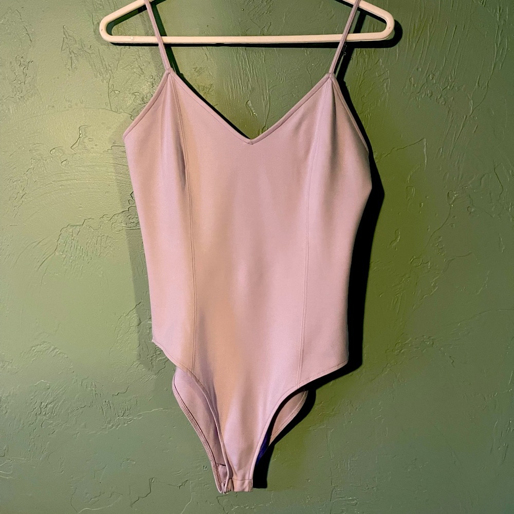 NWOT Lilac bodysuit strappy back cross-cross, snap closure bottom